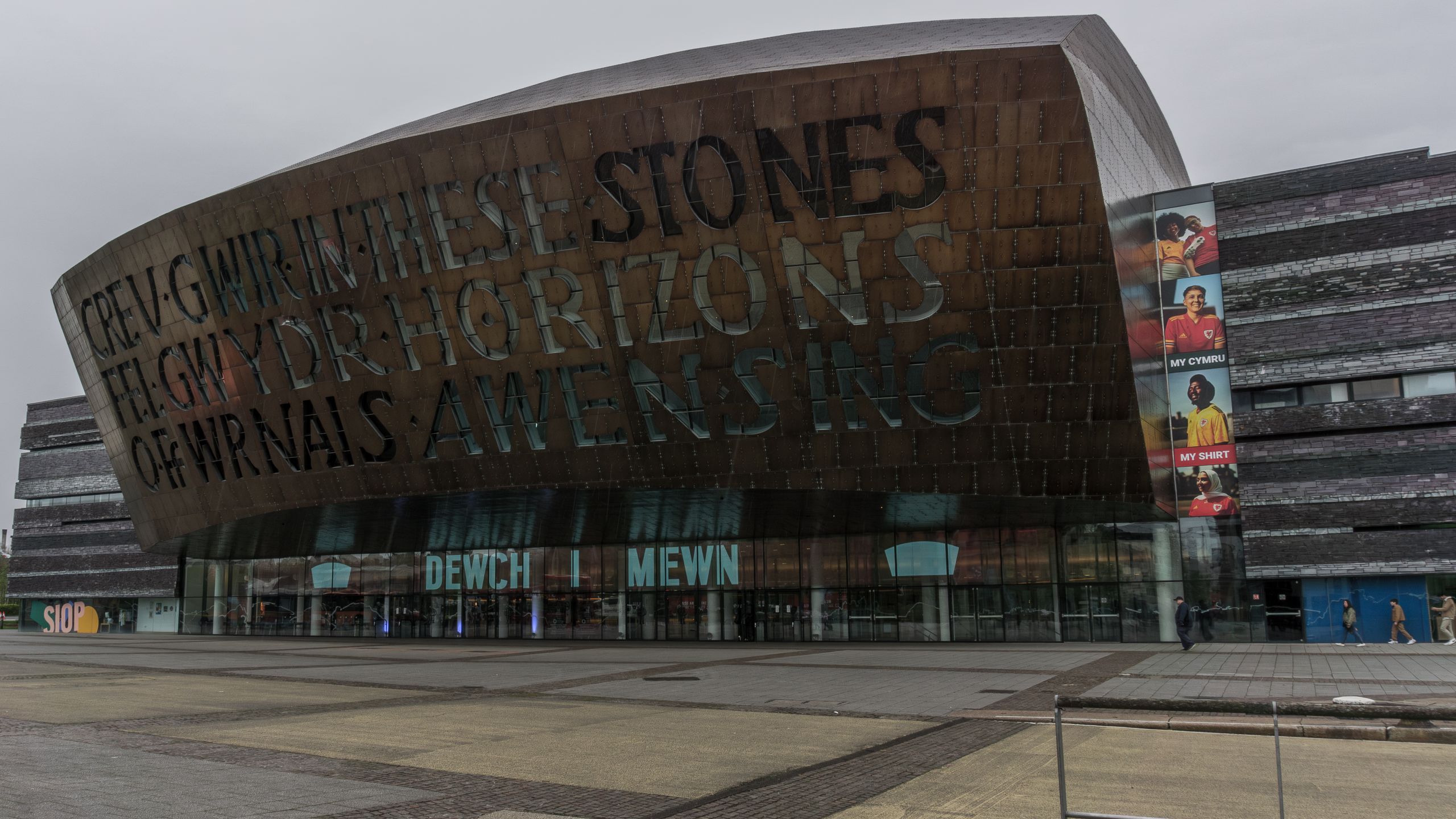 The Wales Millennium Centre in Cardiff Bay, with its bilingual Welsh and English inscription across the bronze front